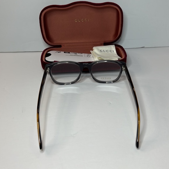 Gucci's GG0004ON soft lines across frames front.Iconic web effect optyl temples - Picture 7 of 14